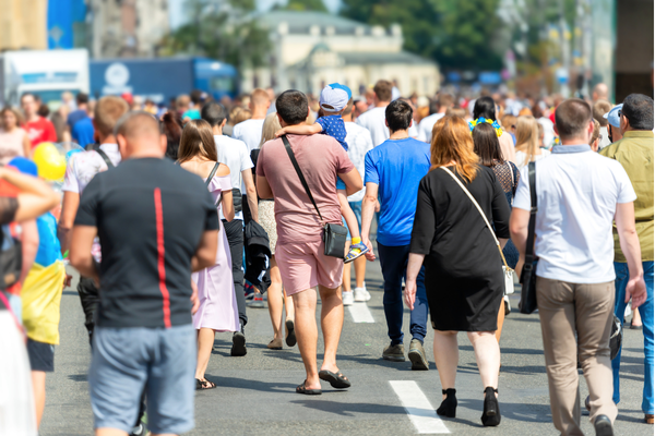 People walking around their city, representing the public sector that Envisio's strategy execution software serves.