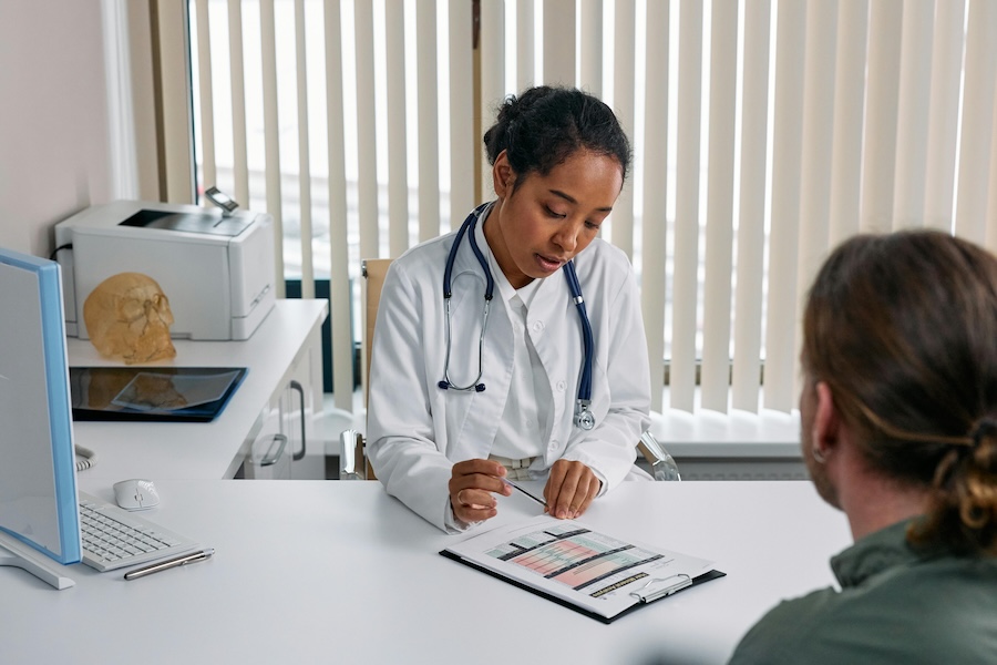 Doctor in Healthcare Planning Strategically with Patient