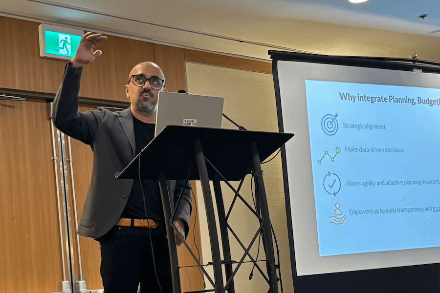 Photo of Envisio staff member presenting at a local government conference.