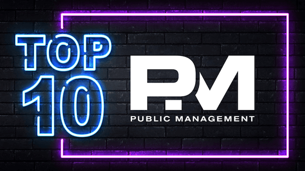 Image of an neon sign displaying the words "Top 10 PM".
