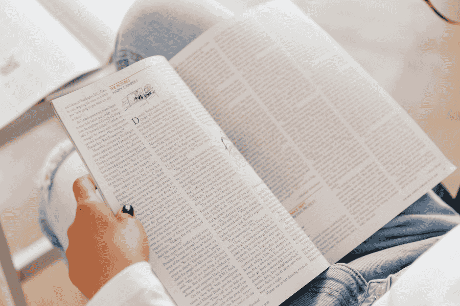 Person reading magazine