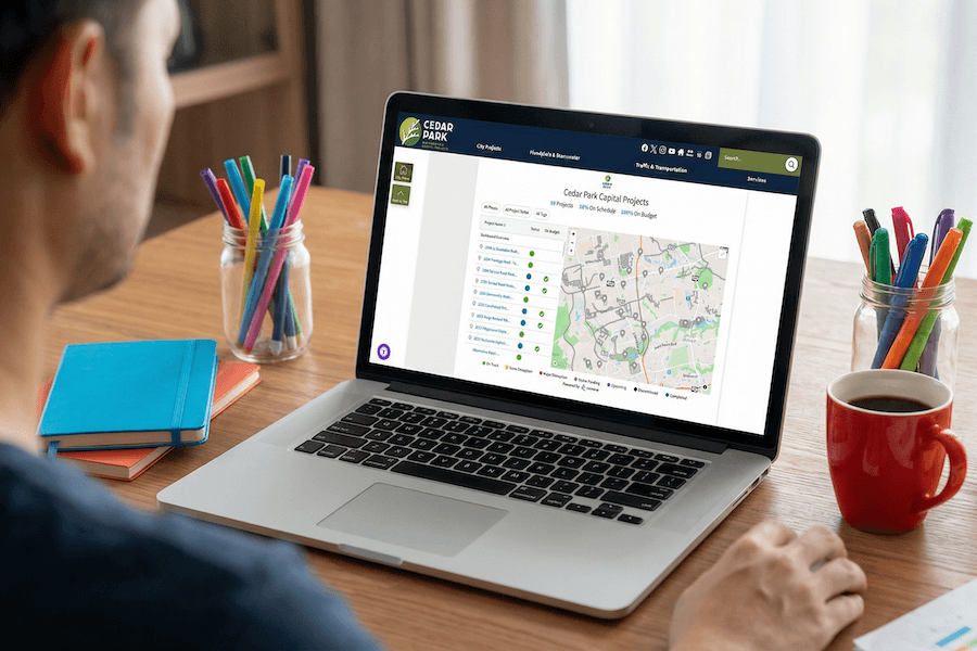 Image of a capital improvement dashboard on a laptop screen on a desk.