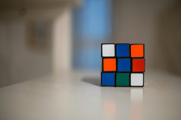 Image of a Rubik's Cube on a desk.