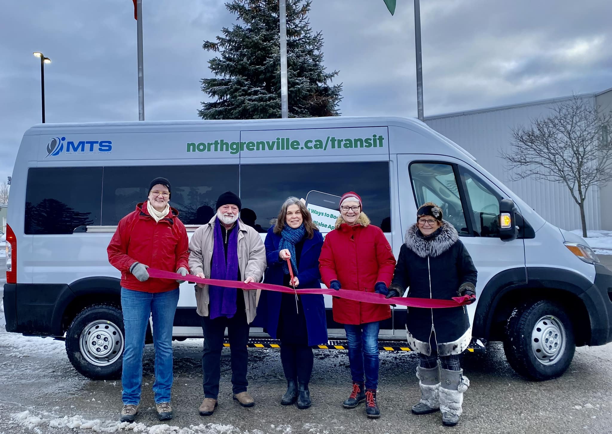 Municipality of Grenville employees standing in front of NGtransit bus for ribbon-cutting